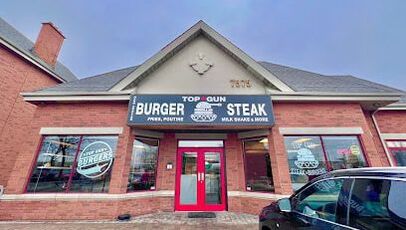 Exterior of a burger eatery with pointed roof in a plaza in Concord, Ontario
