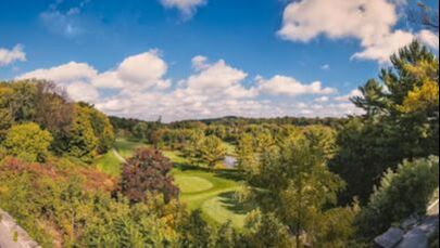 Lush greens and trees surrounding a golf course in Thornhill, Ontario